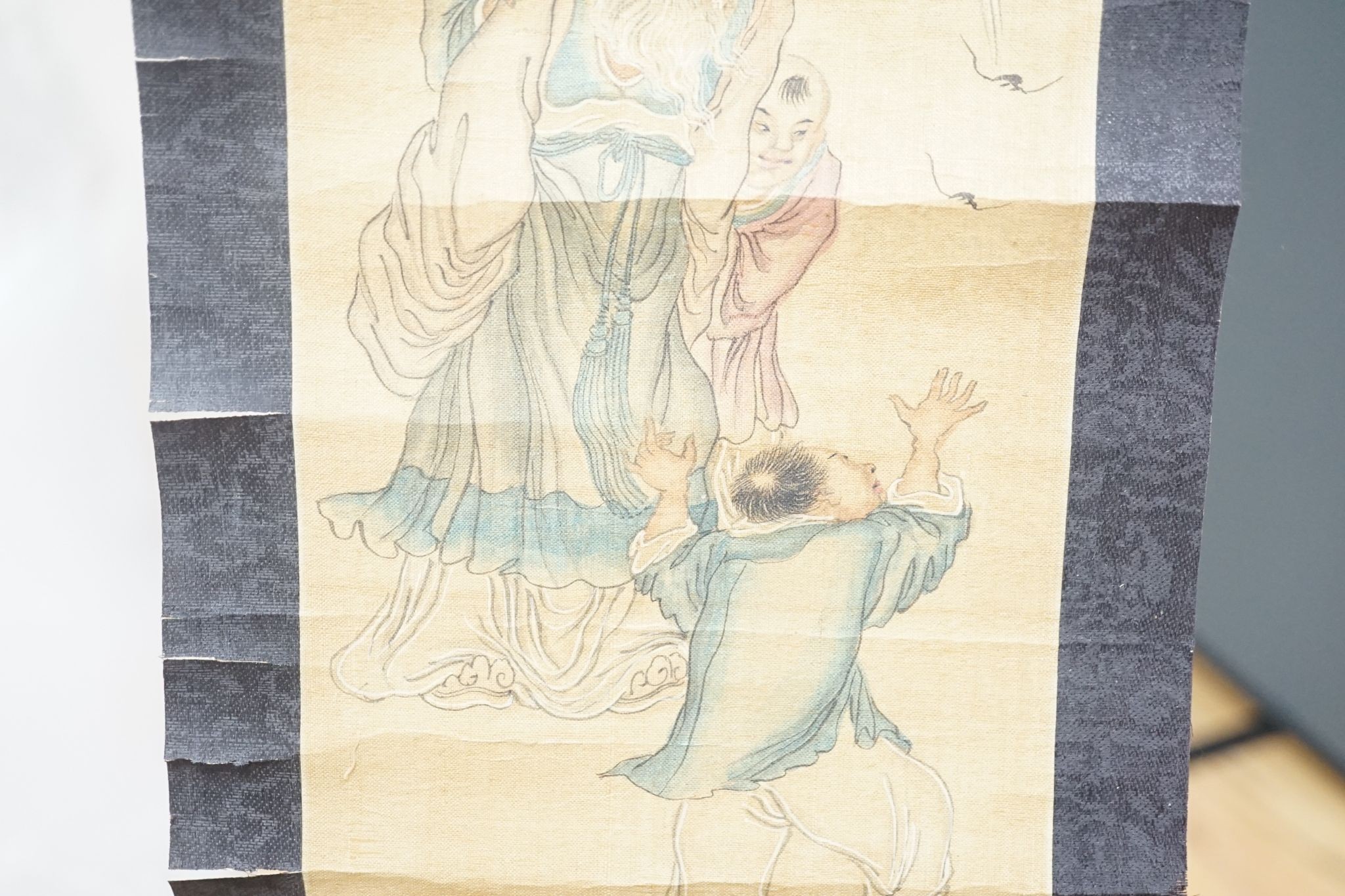 A late 19th century hand scroll and three other scroll paintings